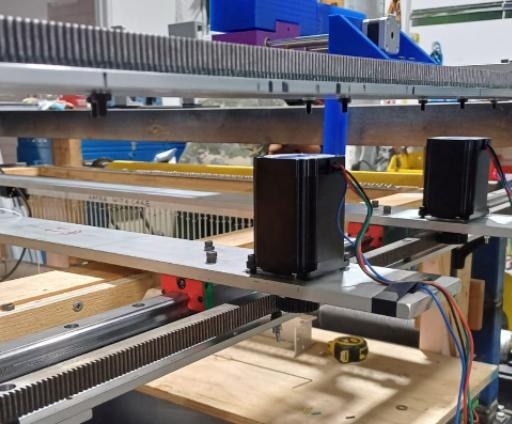 A stepper motor and gear on the finished beam