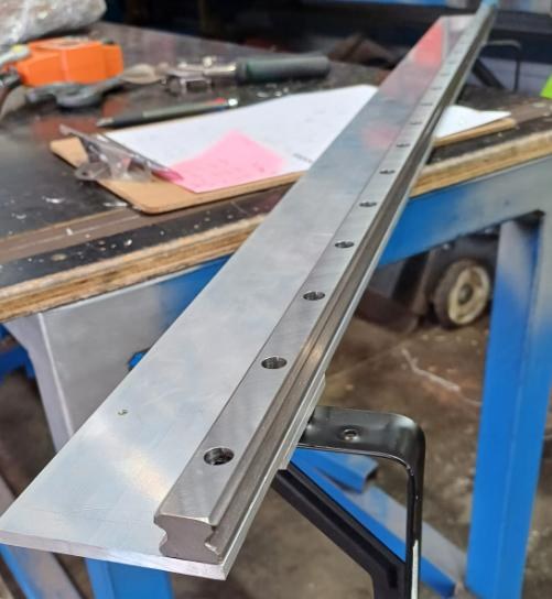 A linear rail on a workbench