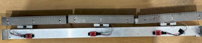 Three strain gauges mounted along the warp beam