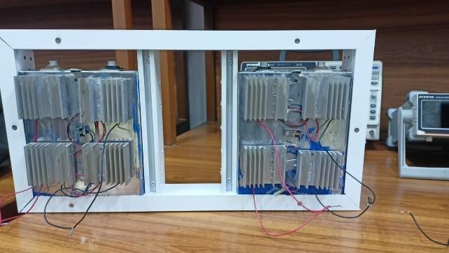 The back of the prototype frame with heat sinks mounted on the thermoelectric coolers