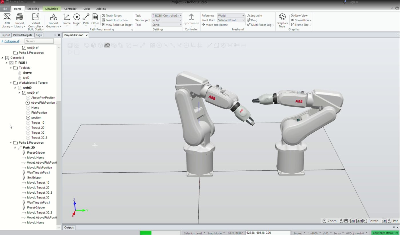 Two ABB robot arms in an ABB RobotStudio simulation